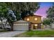 Charming two-story home with a two-car garage and a well-maintained lawn at 1010 Oakhill St, Seffner, FL 33584