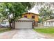 Charming two-story home with a two-car garage and a well-maintained lawn at 1010 Oakhill St, Seffner, FL 33584