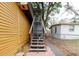 Exterior staircase for reaching upper levels, located off the side of the home at 1010 Oakhill St, Seffner, FL 33584
