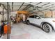 Well-lit garage with stone accents, ample storage, and parking space for a vehicle at 1010 Oakhill St, Seffner, FL 33584