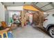 Spacious garage featuring stone accents, convenient storage, and parking for vehicles at 1010 Oakhill St, Seffner, FL 33584