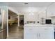 Modern kitchen with island opens to dining area and living room creating a spacious living space at 1010 Oakhill St, Seffner, FL 33584