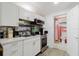 Well-organized kitchen featuring white cabinets, stainless steel appliances and light countertop at 1010 Oakhill St, Seffner, FL 33584