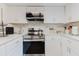 Well-equipped kitchen with stainless steel appliances and white cabinets at 1010 Oakhill St, Seffner, FL 33584