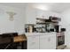 This efficient kitchen has white cabinets, stainless steel appliances, and a breakfast bar area at 1010 Oakhill St, Seffner, FL 33584