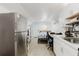 Efficient living area has white cabinets, stainless steel appliances, and a combined living space at 1010 Oakhill St, Seffner, FL 33584