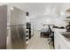 Efficient living area has white cabinets, stainless steel appliances, and a combined living space at 1010 Oakhill St, Seffner, FL 33584
