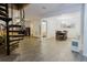 Spacious living and dining area with spiral staircase and sleek, neutral flooring at 1010 Oakhill St, Seffner, FL 33584