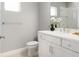 Bright bathroom with a white vanity, modern fixtures, decorative accents, and a tiled shower at 10153 Spruce River Way, Parrish, FL 34219