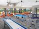 Spacious game room with shuffleboard, foosball, and a pool table at 10153 Spruce River Way, Parrish, FL 34219