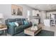 Comfortable living room and bright white kitchen with stainless steel appliances at 10153 Spruce River Way, Parrish, FL 34219