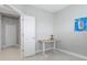 Bright office showcasing a light interior, carpet, a small table, and artwork on the wall at 10153 Spruce River Way, Parrish, FL 34219