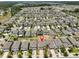 Aerial view of a suburban neighborhood, showcasing closely arranged homes with landscaped yards and tree-lined streets at 10210 White Linen Ave, Riverview, FL 33578