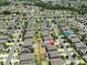 Neighborhood aerial view with a pinpoint marker over a home, highlighting its location amidst a well-planned community at 10210 White Linen Ave, Riverview, FL 33578