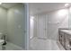Bathroom featuring a granite vanity top, white tiled floor, and a walk-in shower at 10210 White Linen Ave, Riverview, FL 33578