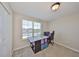 Bright bedroom featuring a crafting area by a window, complete with a sewing machine and ergonomic chair at 10210 White Linen Ave, Riverview, FL 33578