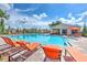 Community pool featuring lounge seating, an umbrella, and a shaded structure at 10210 White Linen Ave, Riverview, FL 33578
