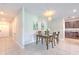 Dining area shows decor, table setting, and kitchen access at 10210 White Linen Ave, Riverview, FL 33578