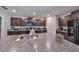 Kitchen with granite countertops, stainless steel sink, and dark wood cabinetry at 10210 White Linen Ave, Riverview, FL 33578