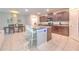 Bright kitchen features an island, stainless appliances, tile floors and a dining area at 10210 White Linen Ave, Riverview, FL 33578