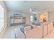 Spacious living room with stylish furniture, ceiling fan, and neutral tones at 10210 White Linen Ave, Riverview, FL 33578