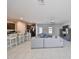 Spacious open concept living and kitchen area with tile flooring and comfortable seating at 10210 White Linen Ave, Riverview, FL 33578