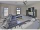 Comfortable living room with modern furniture, a large TV, and plenty of natural light at 10210 White Linen Ave, Riverview, FL 33578