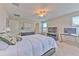 Bright main bedroom featuring a ceiling fan, neutral walls, and a comfortable bed at 10210 White Linen Ave, Riverview, FL 33578