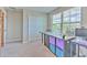 Bright room featuring a large window, sewing machines, and a closet at 10210 White Linen Ave, Riverview, FL 33578