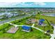 Aerial view of the community playground with walking paths, swings, and a covered picnic area at 10732 Chippewa Dr, Parrish, FL 34219