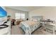 Cozy bedroom features a comfortable bed, natural light, and a functional workspace at 10732 Chippewa Dr, Parrish, FL 34219