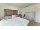 Comfortable bedroom with a queen bed, a neutral color scheme, and simple, elegant furniture at 10732 Chippewa Dr, Parrish, FL 34219