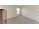 Bedroom with neutral walls and carpet, offering a blank canvas for personalization and comfortable living at 10732 Chippewa Dr, Parrish, FL 34219