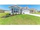 A well maintained house with a lush green yard and nice landscaping at 10732 Chippewa Dr, Parrish, FL 34219