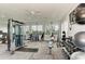 Well-equipped fitness center with modern exercise machines, weights, and bright natural light at 10732 Chippewa Dr, Parrish, FL 34219