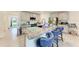 Gourmet kitchen featuring a central island with bar seating and granite countertops at 10732 Chippewa Dr, Parrish, FL 34219