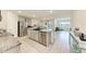 Modern kitchen with stainless steel appliances, granite countertops, and an open layout at 10732 Chippewa Dr, Parrish, FL 34219