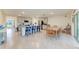 Spacious kitchen with bar seating flows into dining, creating an inclusive entertaining area at 10732 Chippewa Dr, Parrish, FL 34219