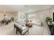Spacious living room with neutral decor, comfortable seating, and lots of natural light at 10732 Chippewa Dr, Parrish, FL 34219