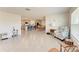 Spacious living room showcasing an open floor plan leading to the kitchen and dining area at 10732 Chippewa Dr, Parrish, FL 34219