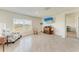 Bright living room featuring tile flooring, lots of natural light, and neutral paint at 10732 Chippewa Dr, Parrish, FL 34219