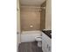 Bathroom with a shower and tub combination and modern fixtures at 1107 Howard St, Clearwater, FL 33756