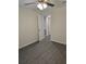 Cozy bedroom with luxury vinyl plank flooring, neutral paint, and a ceiling fan at 1107 Howard St, Clearwater, FL 33756