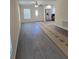 Open-concept living room with luxury vinyl plank flooring and a ceiling fan at 1107 Howard St, Clearwater, FL 33756