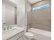 Bathroom features single vanity and shower/tub combo with tiled walls at 11737 Myakka Blue Dr, Venice, FL 34293