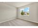 Bedroom with neutral carpet and one window for natural light at 11737 Myakka Blue Dr, Venice, FL 34293