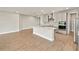 Modern kitchen with a large center island, stainless steel appliances, and stylish gray cabinets at 11737 Myakka Blue Dr, Venice, FL 34293
