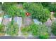 Overhead view of house highlighting roof and proximity to neighboring houses, surrounded by mature trees at 1262 Jeffords St, Clearwater, FL 33756