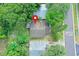 Bird's eye view of house showcasing the roof, landscaping, and adjacent properties in a residential setting at 1262 Jeffords St, Clearwater, FL 33756