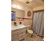 Bathroom featuring a vanity, toilet, tile flooring, shower curtain and decorative mirror at 1262 Jeffords St, Clearwater, FL 33756
